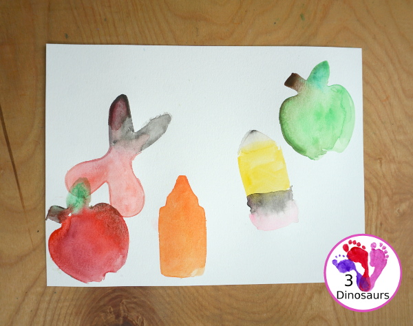 School Cookie Cutter Watercolor Painting - a super easy back to school watercolor painting with cookie cutters with school themes of pencils, scissors, crayons and apples - 3Dinosaurs.com