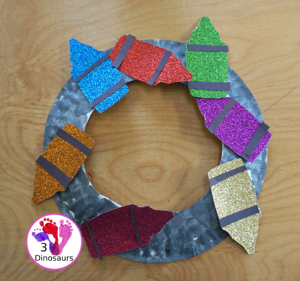 Glitter Crayon Wreath Craft For Kids - a great color or back to school glitter crayons wreath you can make with kids. - 3Dinosaurs.com