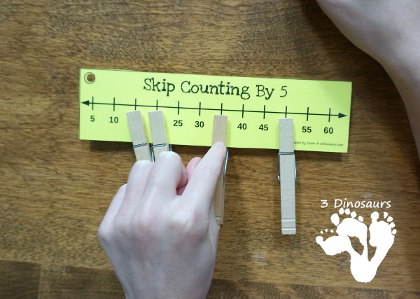 Free Skip Counting Number Line Bookmarks - skip counting number line bookmarks for 1 to 12 or 1 to 15 plus - see how to use clothespins on the bookmarks - 3Dinosaurs.com