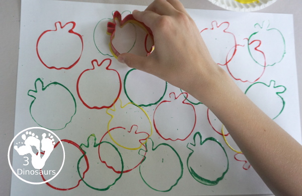 Apple Stamp Painting for Kids - a fun cookie cutter painting idea for apples with red, green and yellow paint - 3Dinosaurs.com