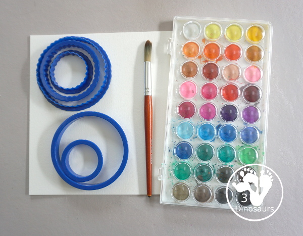 Circle Watercolor Painting with Cookie Cutters - a is great shape painting you can do with kids. You can use different sizes of cookie cutters for it and paint inside the cookie cutter to get the shape. - 3Dinosaurs.com