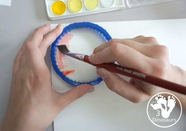 Circle Watercolor Painting with Cookie Cutters - a is great shape painting you can do with kids. You can use different sizes of cookie cutters for it and paint inside the cookie cutter to get the shape. - 3Dinosaurs.com