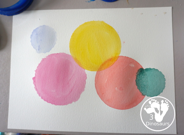 Circle Watercolor Painting with Cookie Cutters - a is great shape painting you can do with kids. You can use different sizes of cookie cutters for it and paint inside the cookie cutter to get the shape. - 3Dinosaurs.com