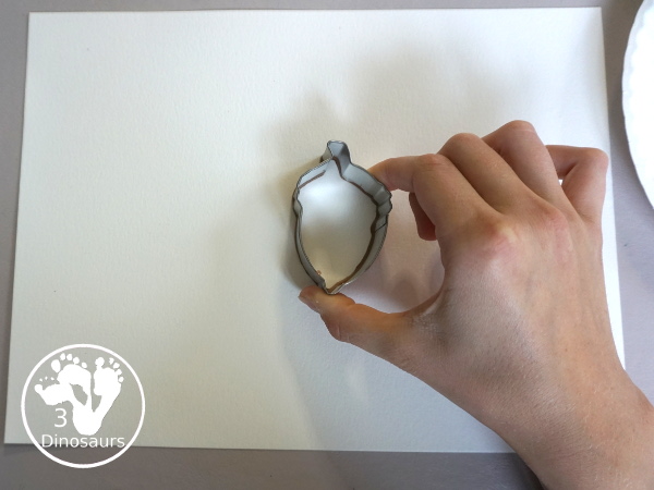 Fall Cookie Cutter Painting - with an acorn, pumpkins and a leaf. Great fun theme for fall! A great painting idea for preschool and prek. 3Dinosaurs.com