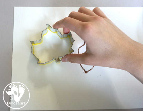 Fall Cookie Cutter Painting - with an acorn, pumpkins and a leaf. Great fun theme for fall! A great painting idea for preschool and prek. 3Dinosaurs.com