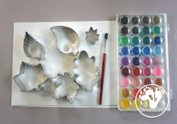 Leaves Cookie Cutter Painting - a fun fall painting wiht leaves. You can use a mix of red, yellow, orange and brown colors with this watercolor painting - 3Dinosaurs.com