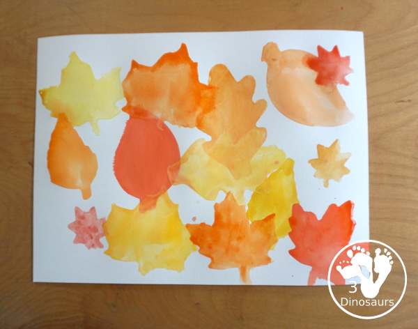 Leaves Cookie Cutter Painting - a fun fall painting with leaves. You can use a mix of red, yellow, orange and brown colors with this watercolor painting - 3Dinosaurs.com